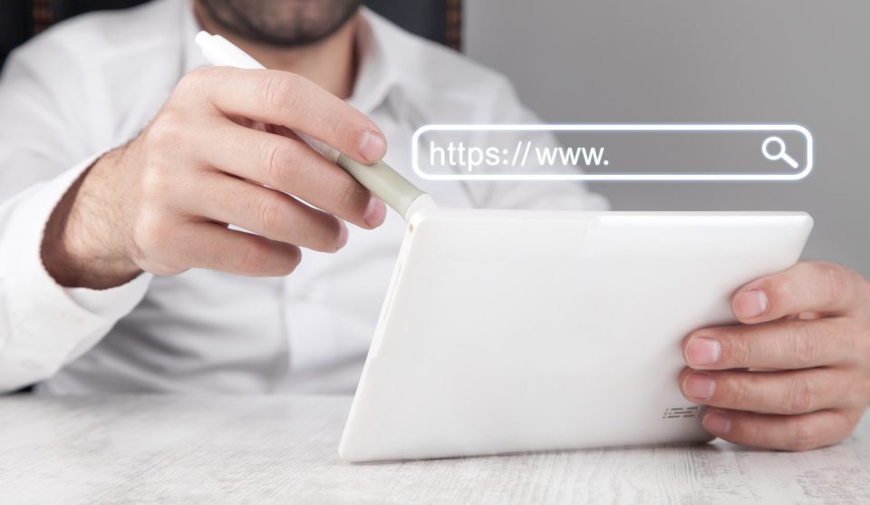 man using white digital tablet 1024x557 1