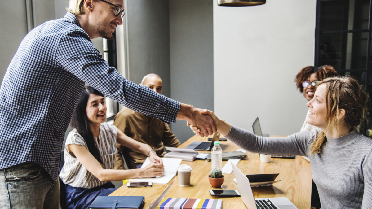 business people shaking hands agreement scaled