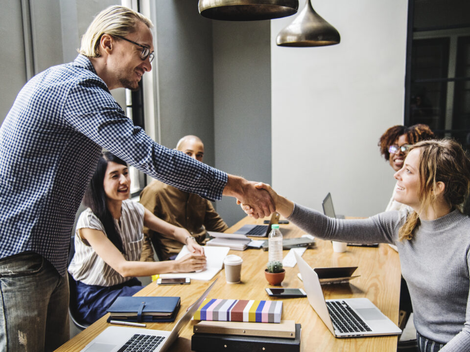 business people shaking hands agreement scaled